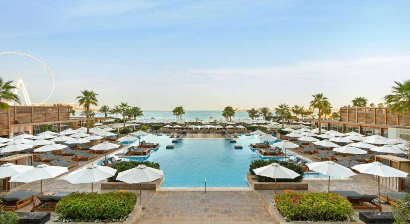 Infinity pool overlooking the Arabian Gulf at Rixos Premium Dubai with private beach access
