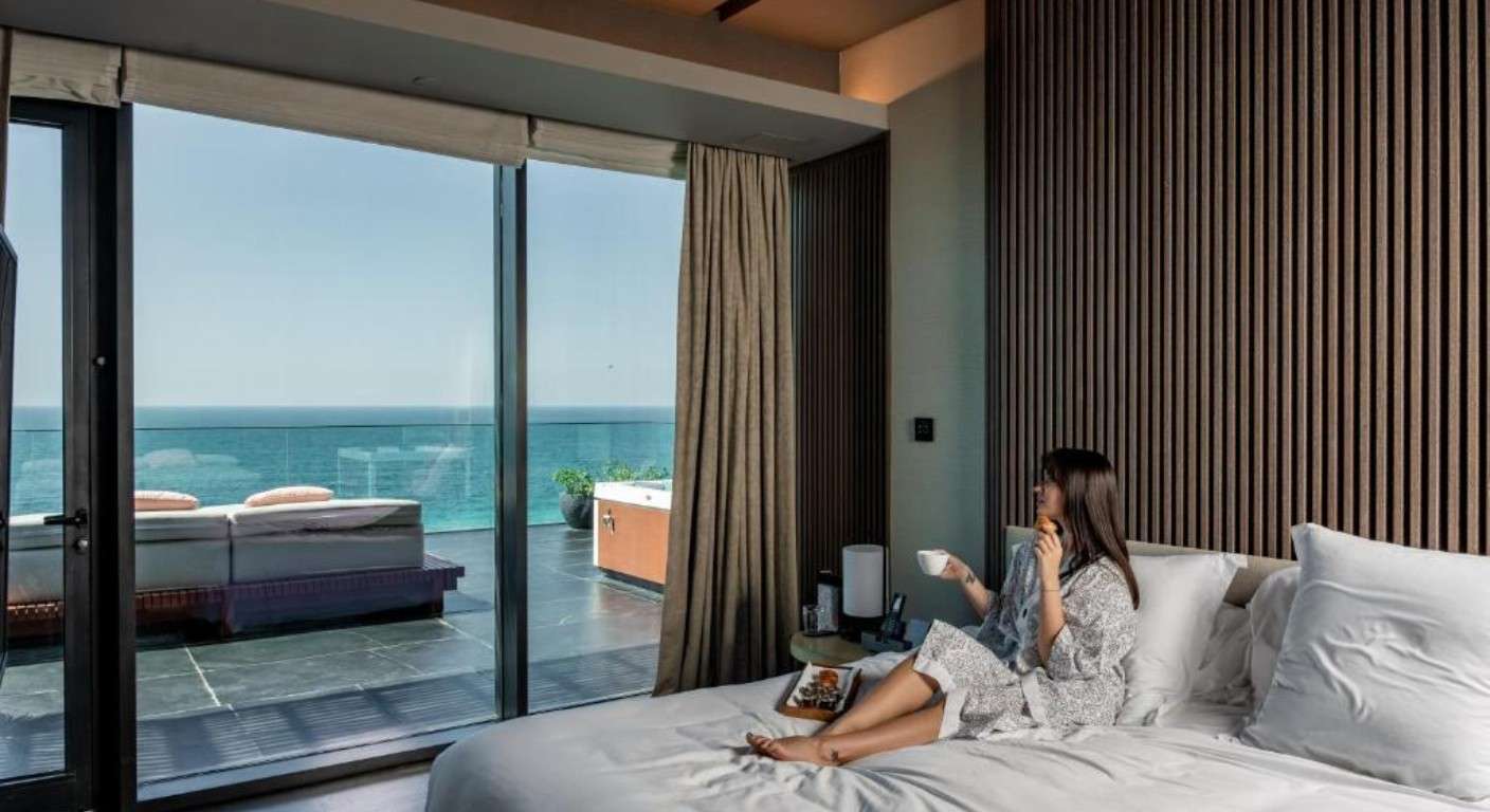 Caesars Palace Bluewaters Dubai beachfront resort with private beach and paddleboarding activity