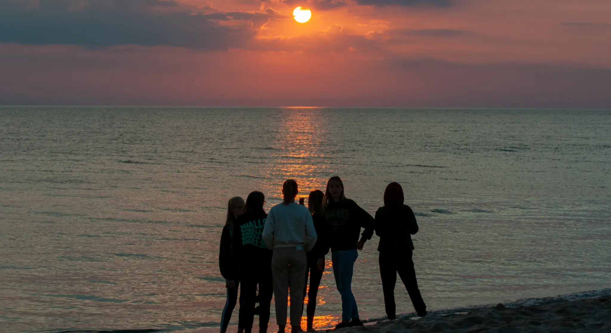 Friends enjoying sunset views during a weekend escape at Jebel Jais