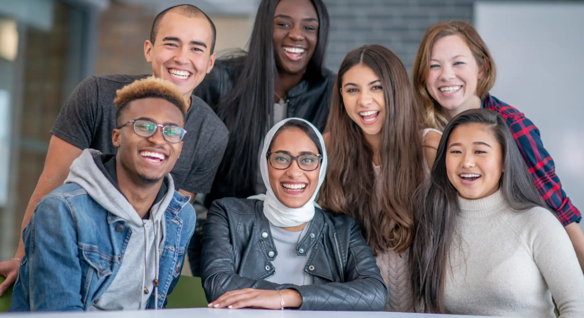 Corporate group team smiling together during Jebel Jais company outing
