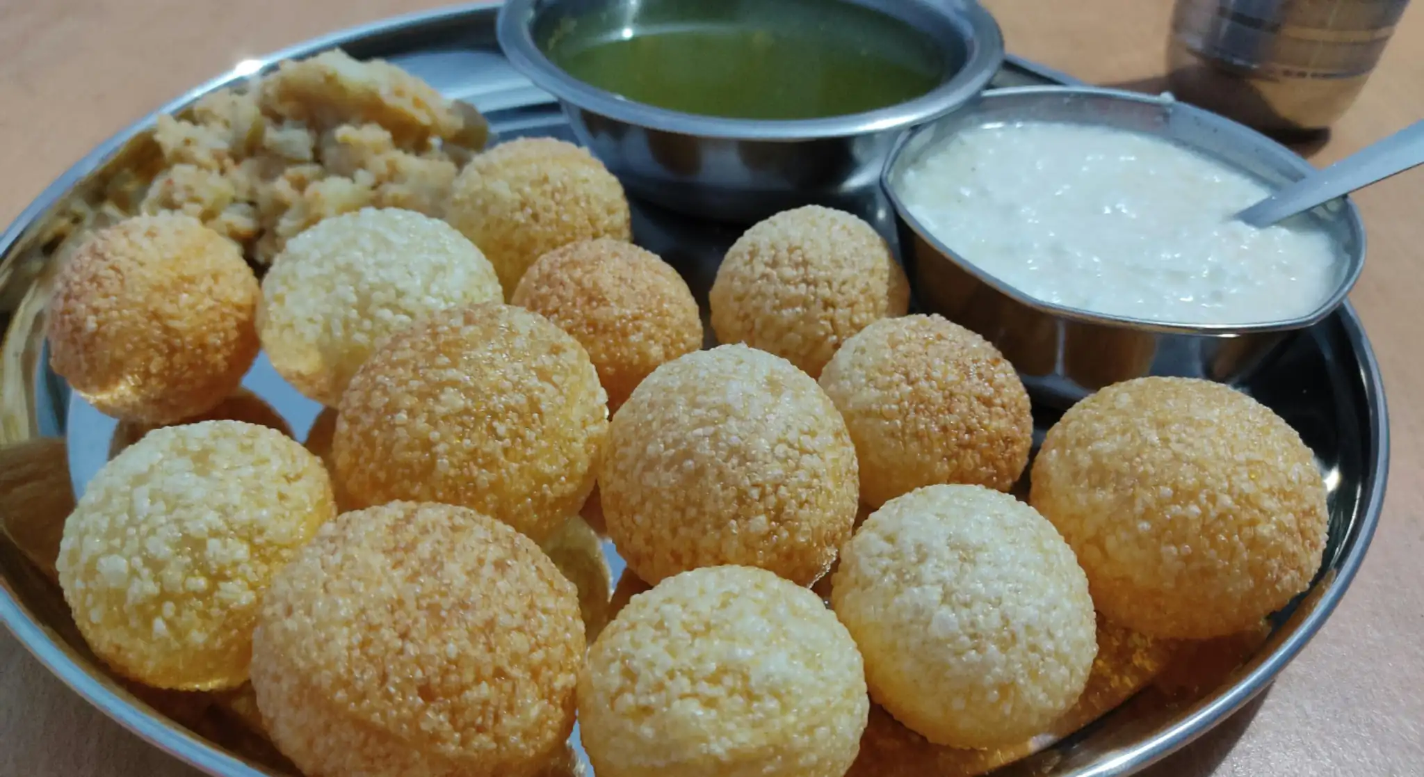 Pani puri chaat with flavoured water and yoghurt