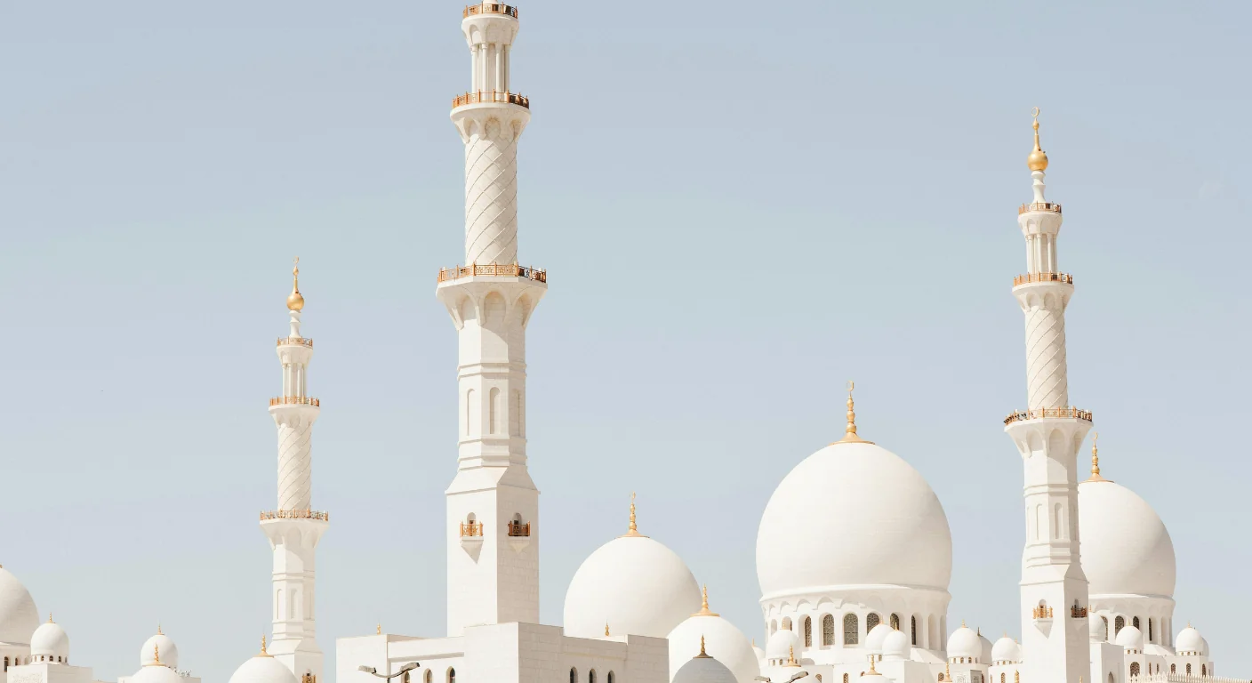 Sheikh Zayed Grand Mosque in Abu Dhabi with white domes and minarets