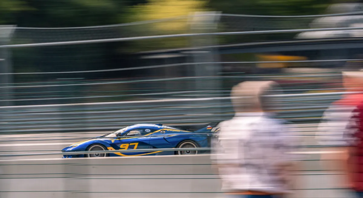 High-speed Ferrari car racing on Yas Marina Circuit Abu Dhabi motorsport experience