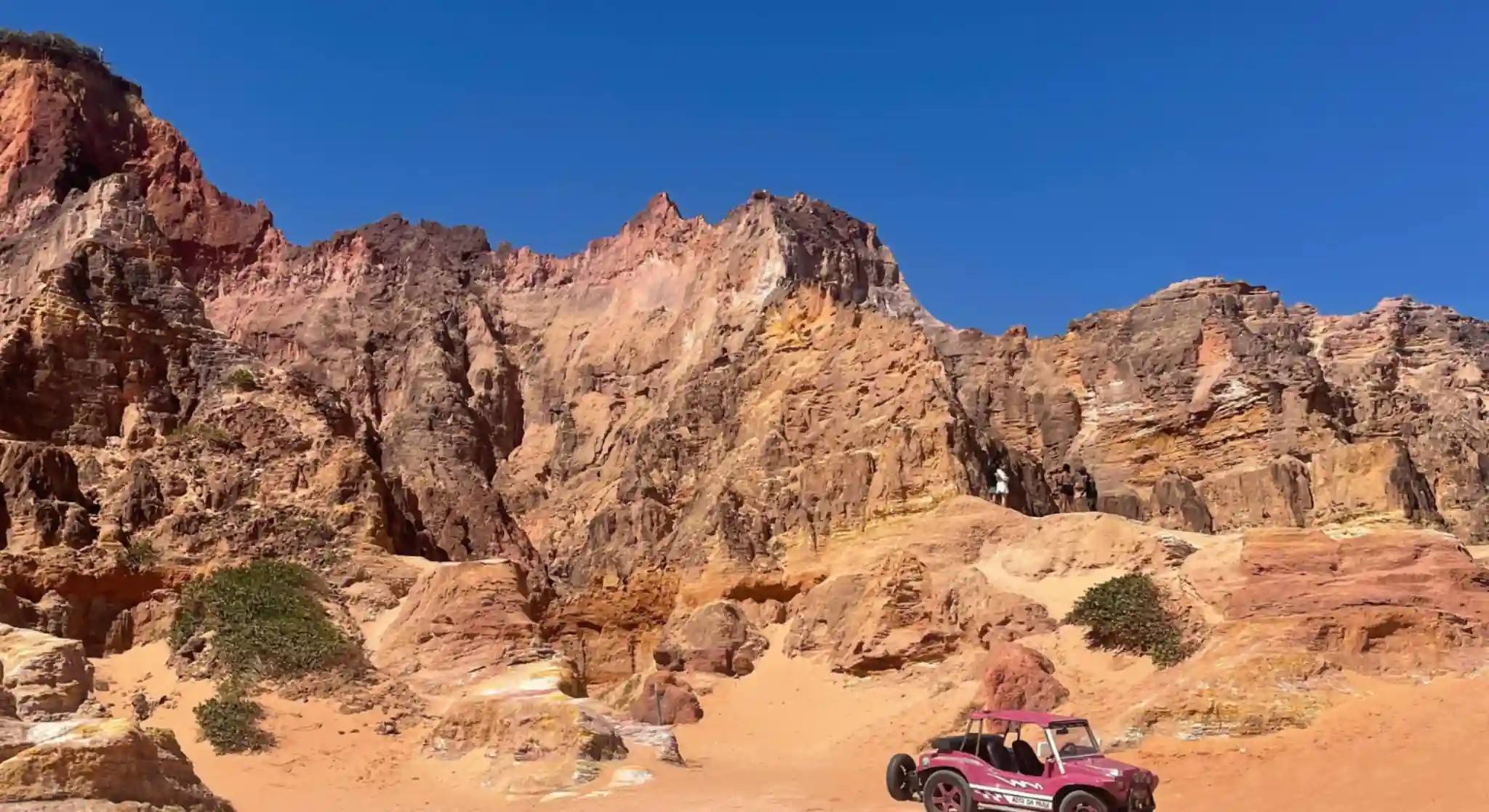 Off-road buggy near rocky desert mountains Dubai adventure tour