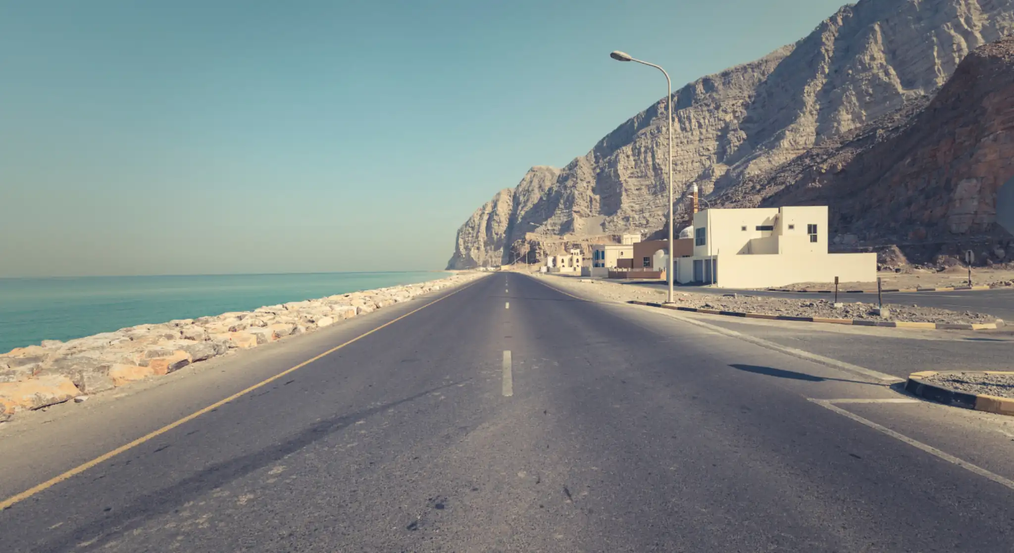 Scenic coastal road drive in Musandam mountains near Khasab Oman