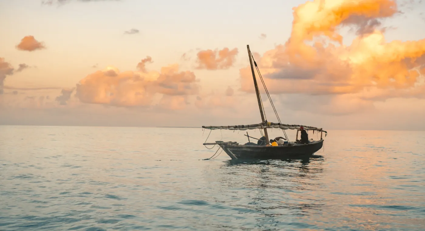 Traditional dhow cruise at sunset in Musandam fjords Arabian Gulf