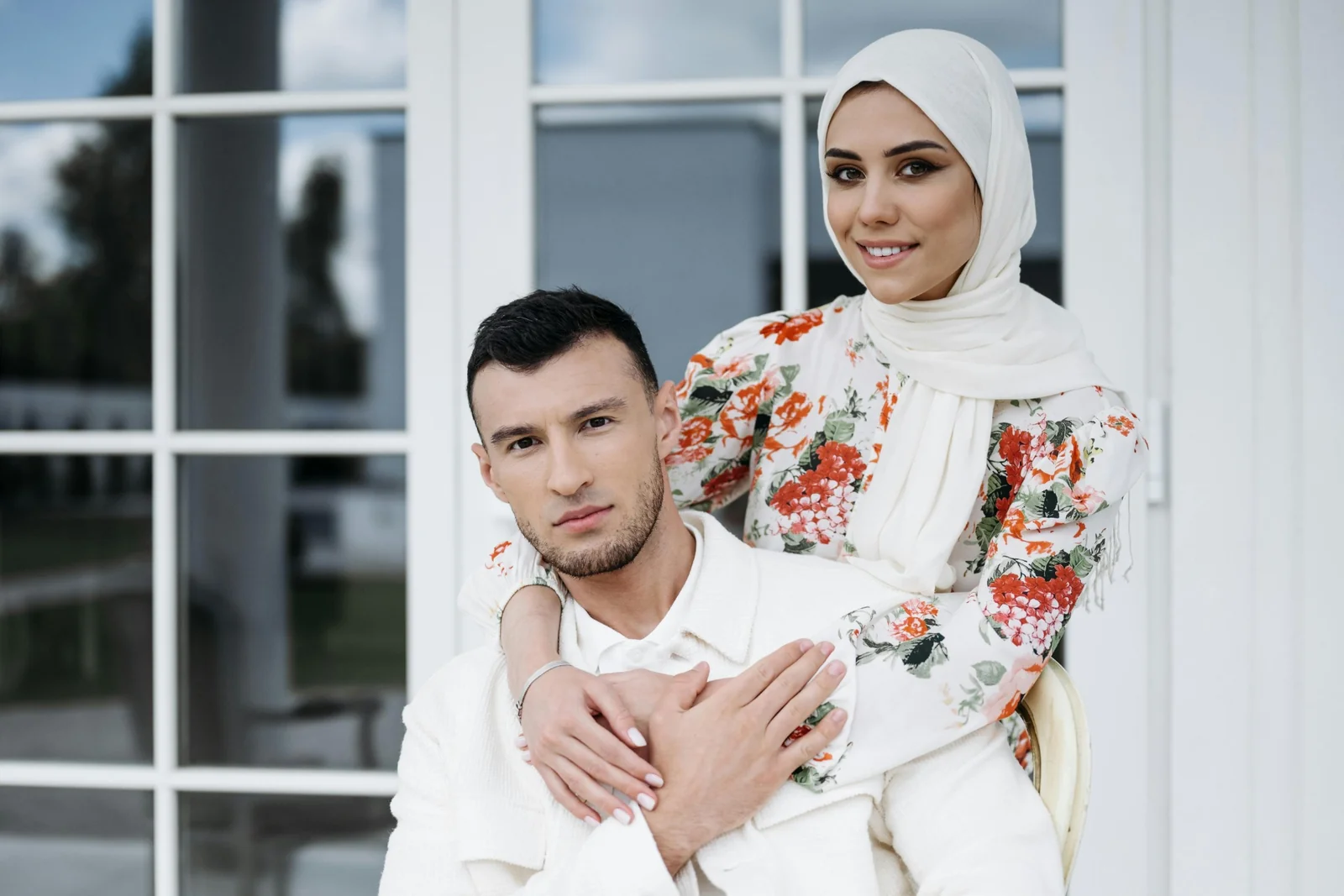 Smiling couple standing together outdoors