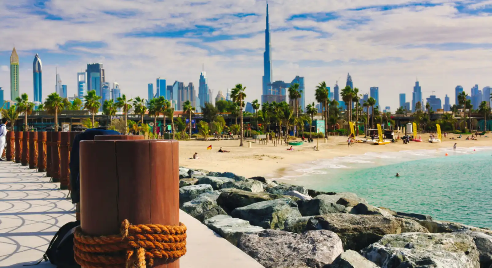 Dubai beach coastline with Burj Khalifa skyline view on a sunny day