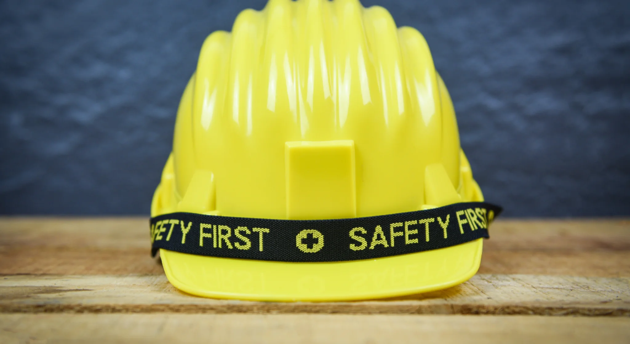 Safety helmet with safety first text construction protection equipment concept