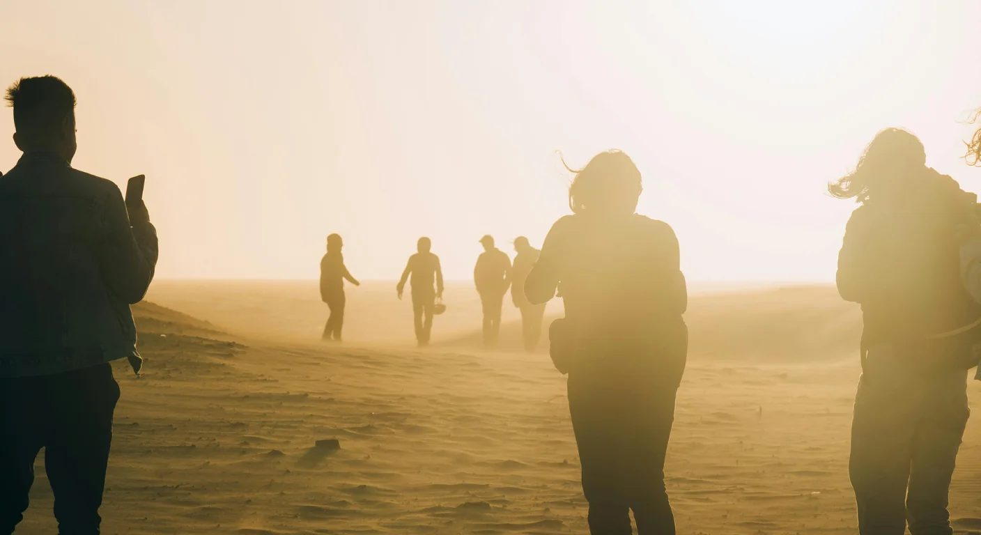 tourists walking in desert during sunset sandstorm desert landscape