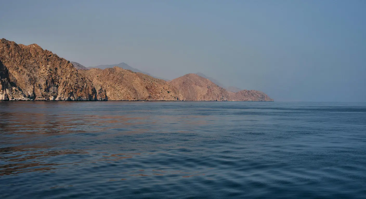 Musandam coastline from Dubai with calm sea and rugged mountains in Oman fjords