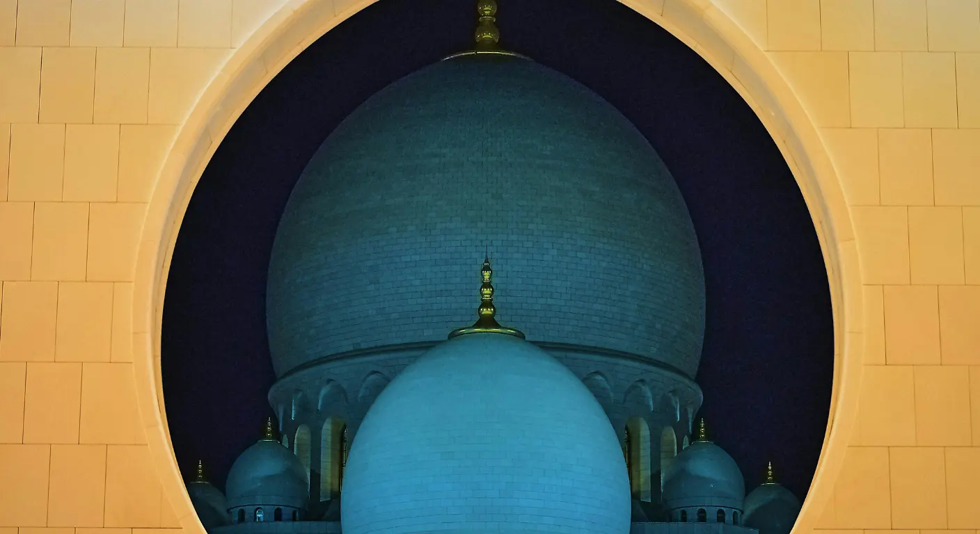 Close-up view of Sheikh Zayed Grand Mosque dome architecture illuminated at night Abu Dhabi