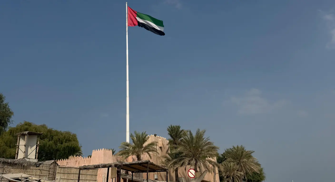 UAE national flag at heritage site representing UAE visa and travel regulations