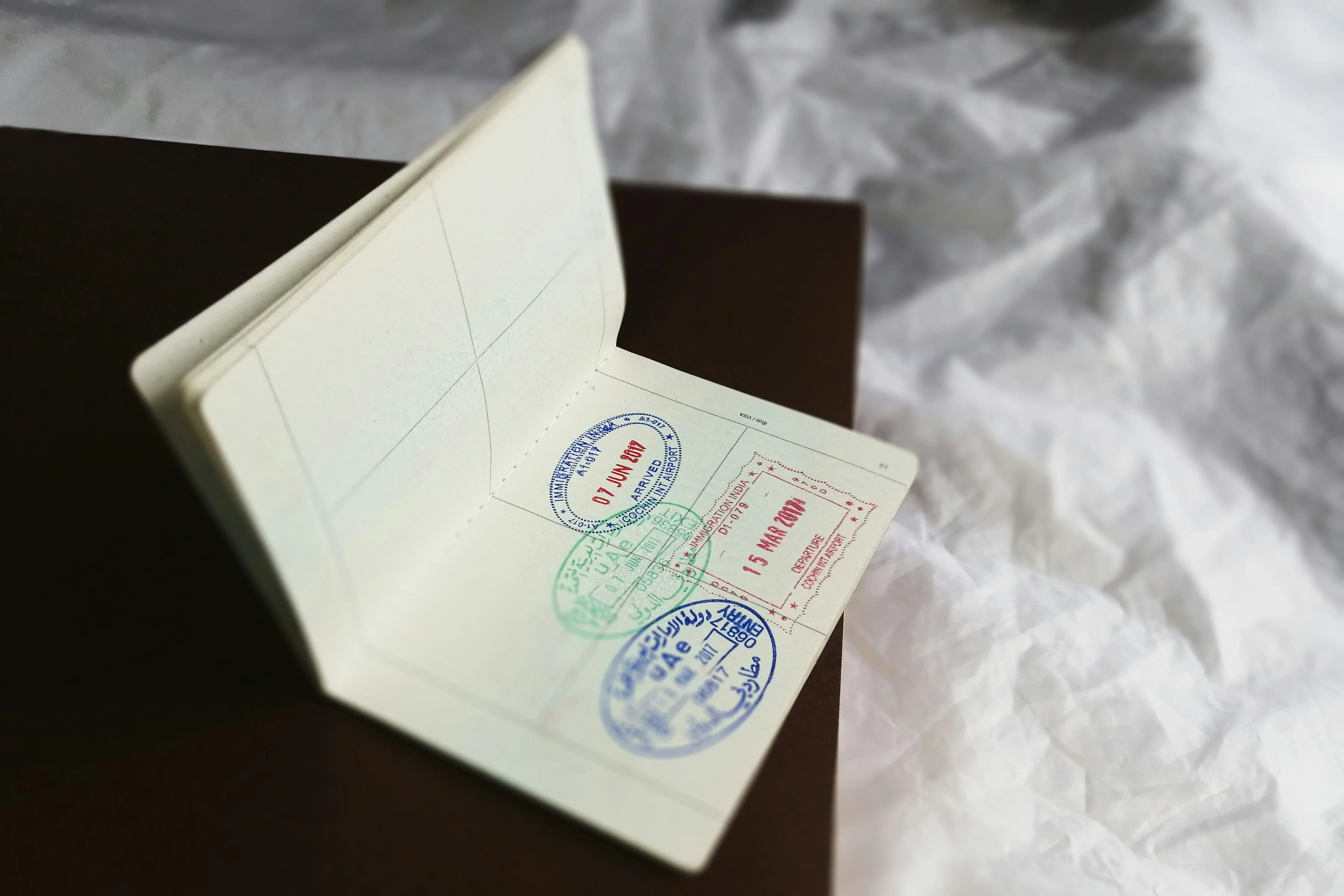UAE visa stamps on passport showing entry and exit immigration details