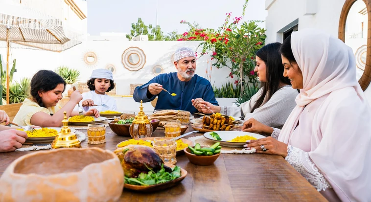Guests sharing a traditional Emirati meal on floor seating at the Sheikh Mohammed Centre for Cultural Understanding, Al Fahidi