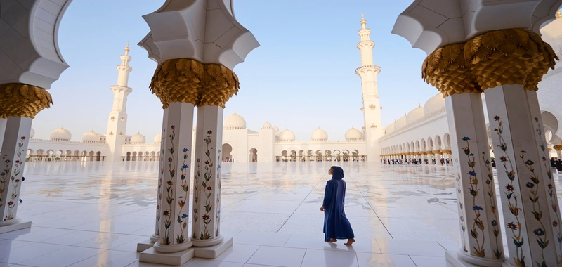 Sheikh Zayed Grand Mosque courtyard in Abu Dhabi during a late afternoon visit before sunset