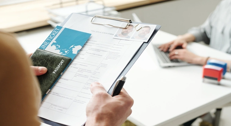 UAE tourist visa application documents with passport and flight ticket