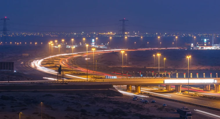 UAE highway at night during a cross-border road trip