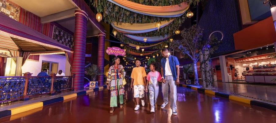 Family exploring a colourful Arabian-themed indoor attraction in Dubai