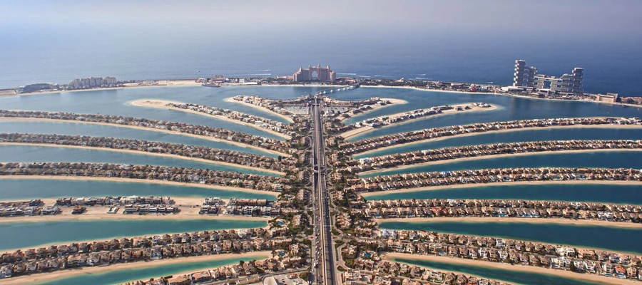 Aerial view of Palm Jumeirah with waterfront villas and Atlantis The Palm in Dubai
