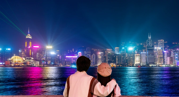 Couple overlooking Hong Kong skyline during a city trip