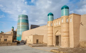 The walled old town of Ichan Kala with Kalta Minor in Khiva, Uzbekistan