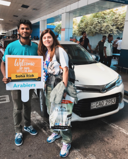 Jude Abraham, Sri Lanka Tour Manager at Arabiers Holidays, greeting international guests on arrival at Bandaranaike International Airport, Colombo, with a private transfer arranged and ready outside