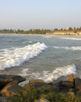 Bentota Beach coastline with waves and seaside resorts, featured in Arabiers Holidays Sri Lanka guide by Jude Abraham