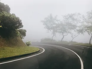 Foggy hill road used by Arabiers drivers for Ella Gap route planning in Sri Lanka